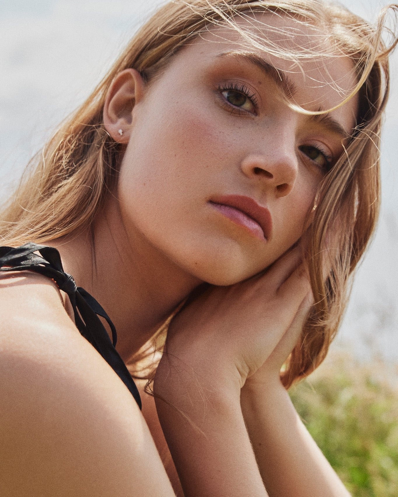 Model wearing the Diamond Duo Stud earring with two prong-set lab-grown diamonds in white gold.