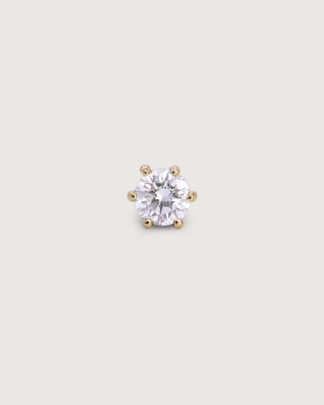 Round brilliant-cut diamond in a six-prong 14k gold setting