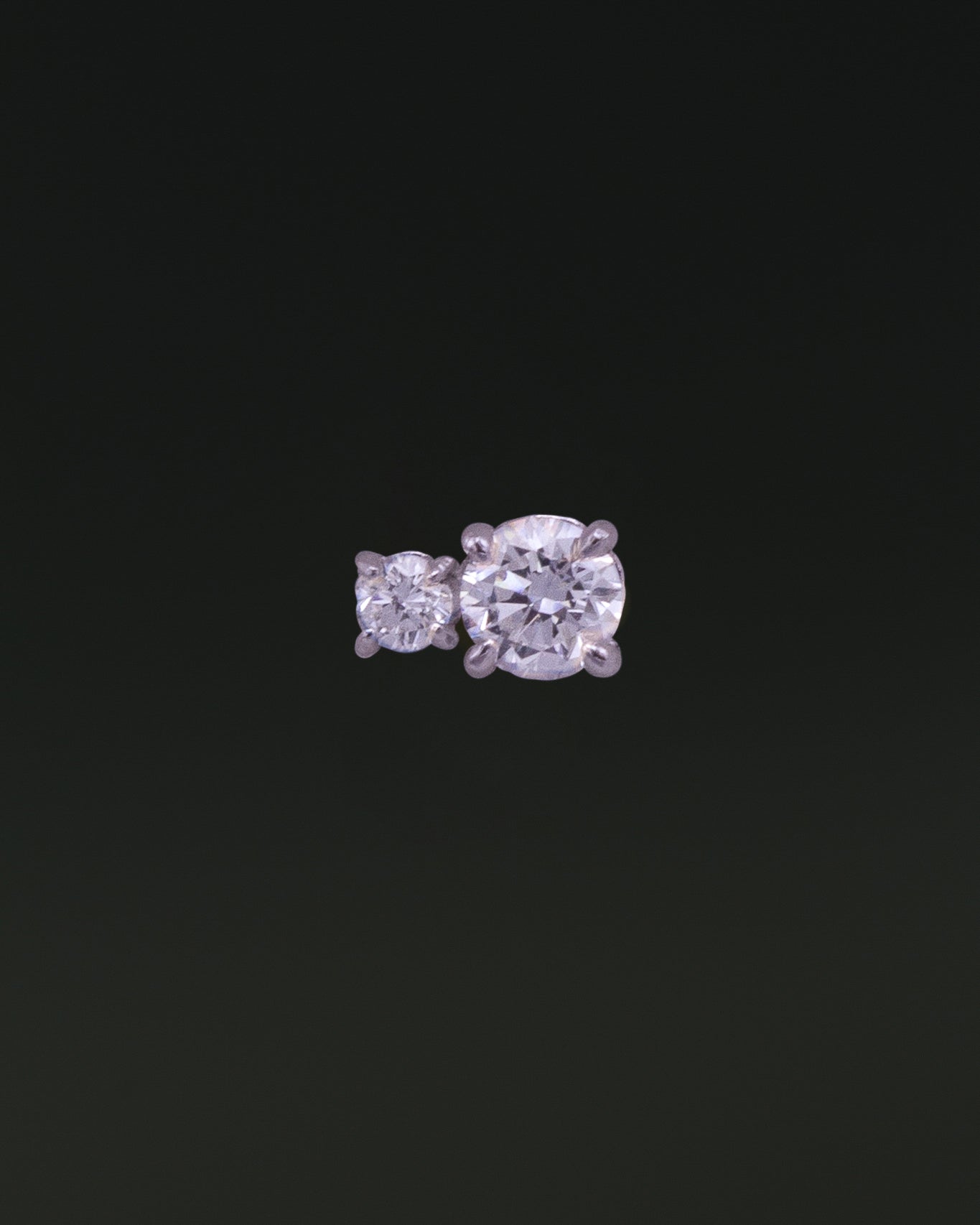 Diamond Duo Stud earring in 14K recycled white gold, featuring two lab-grown diamonds in prong settings, one smaller and one larger.